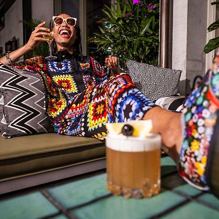 Qt Melbourne Hotel Bagian luar foto A woman drinking a beer